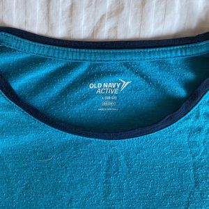 Short sleeve turquoise athletic t-shirt.